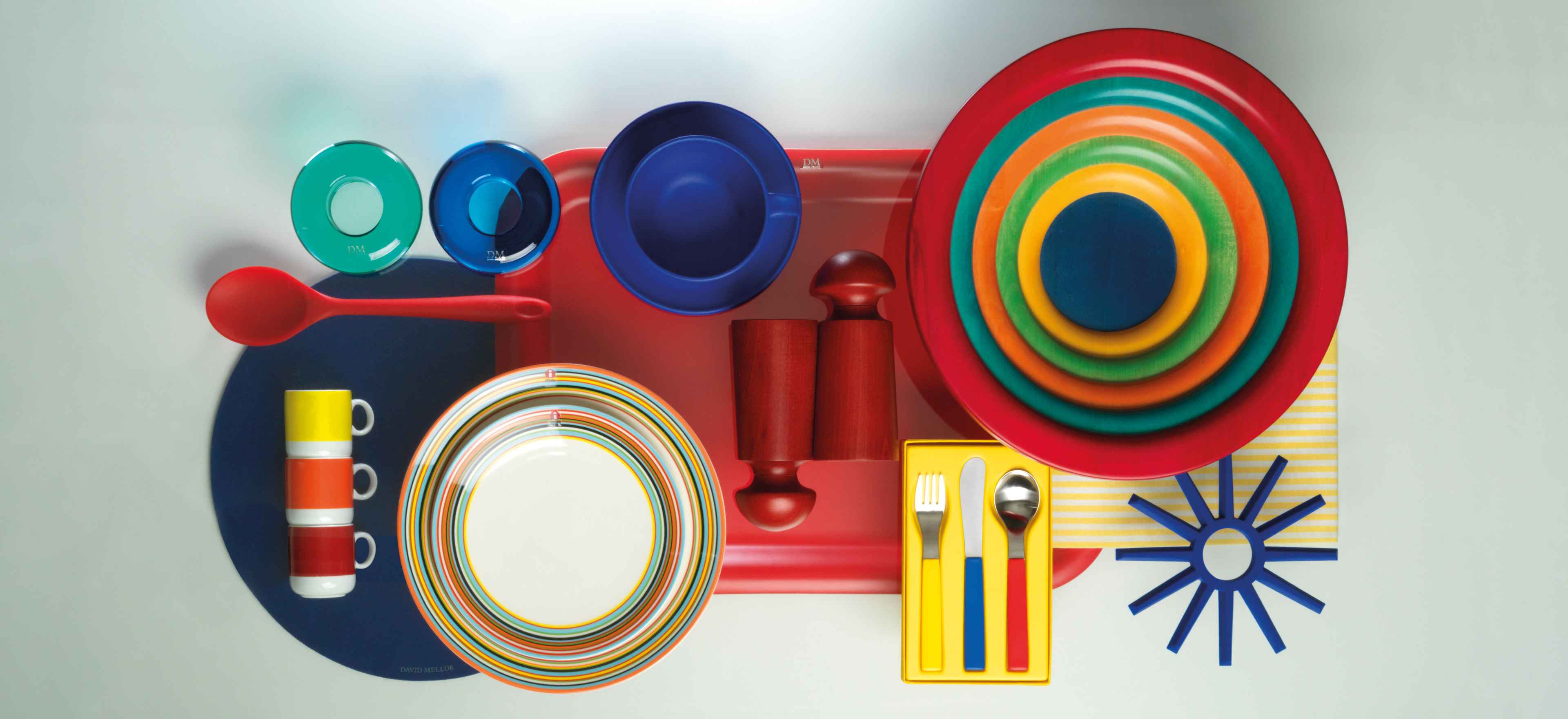 Colourful items such as our David Mellor British Standard mugs, trivets, Manzoni bowls, towels.