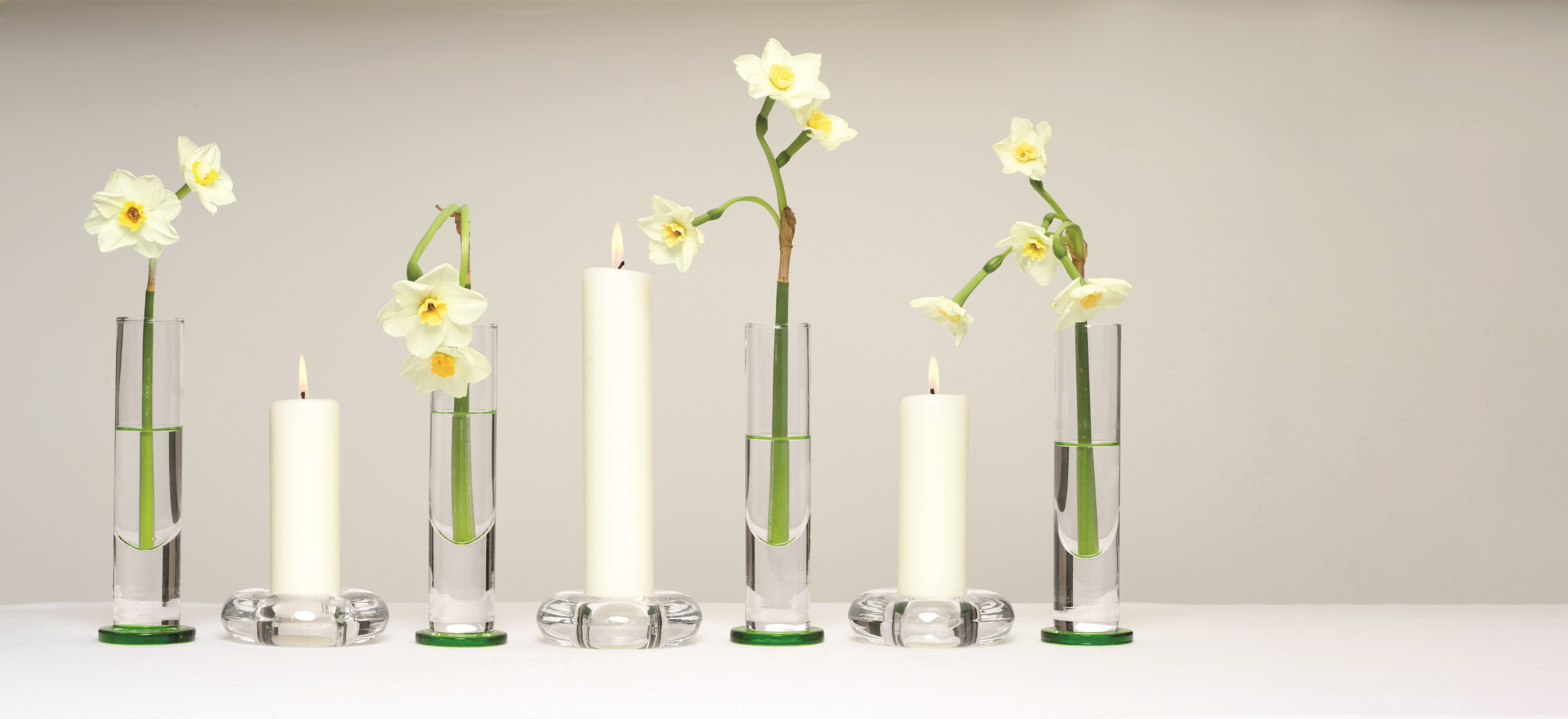 David Mellor column glassware on a grey background.