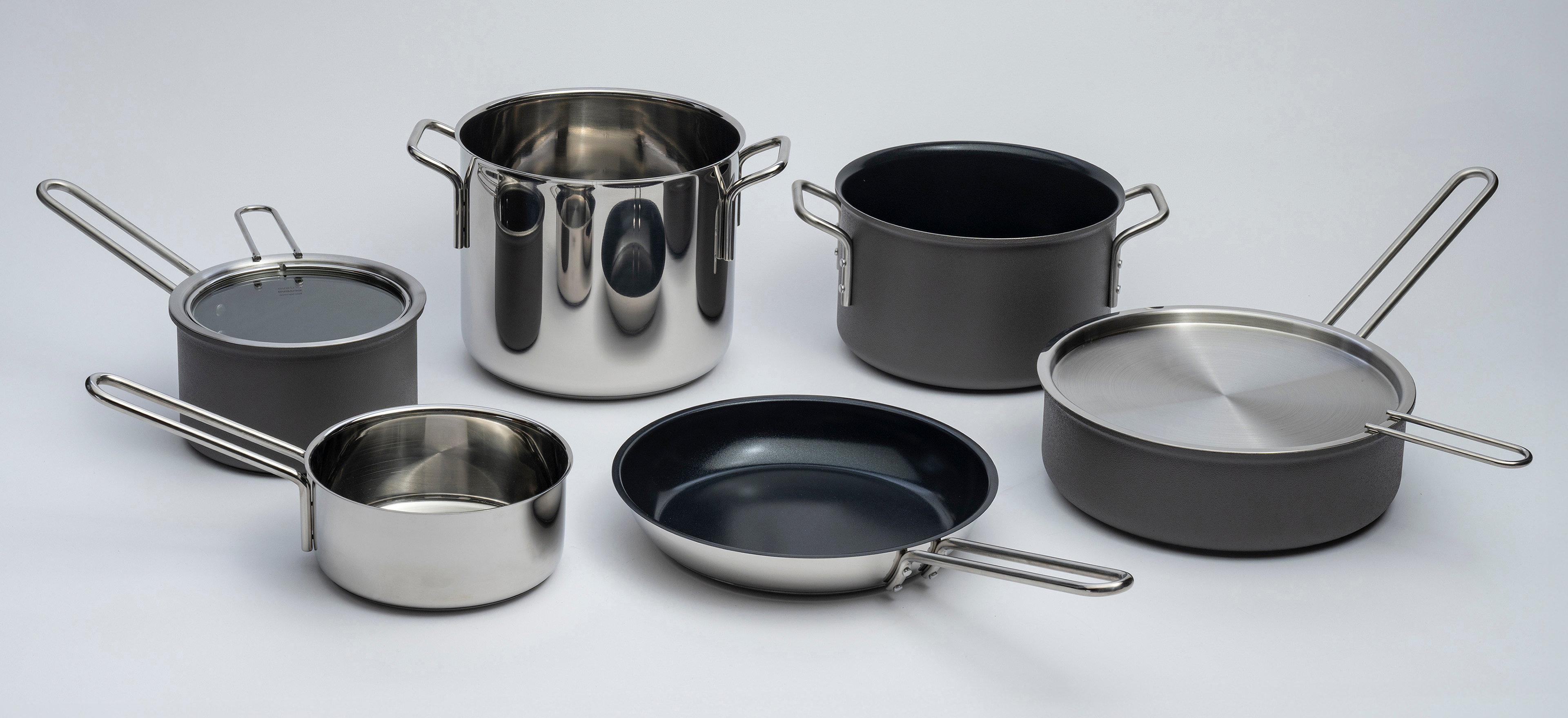Eva Trio stainless steel and Eva Trio Grey Line on a grey background.