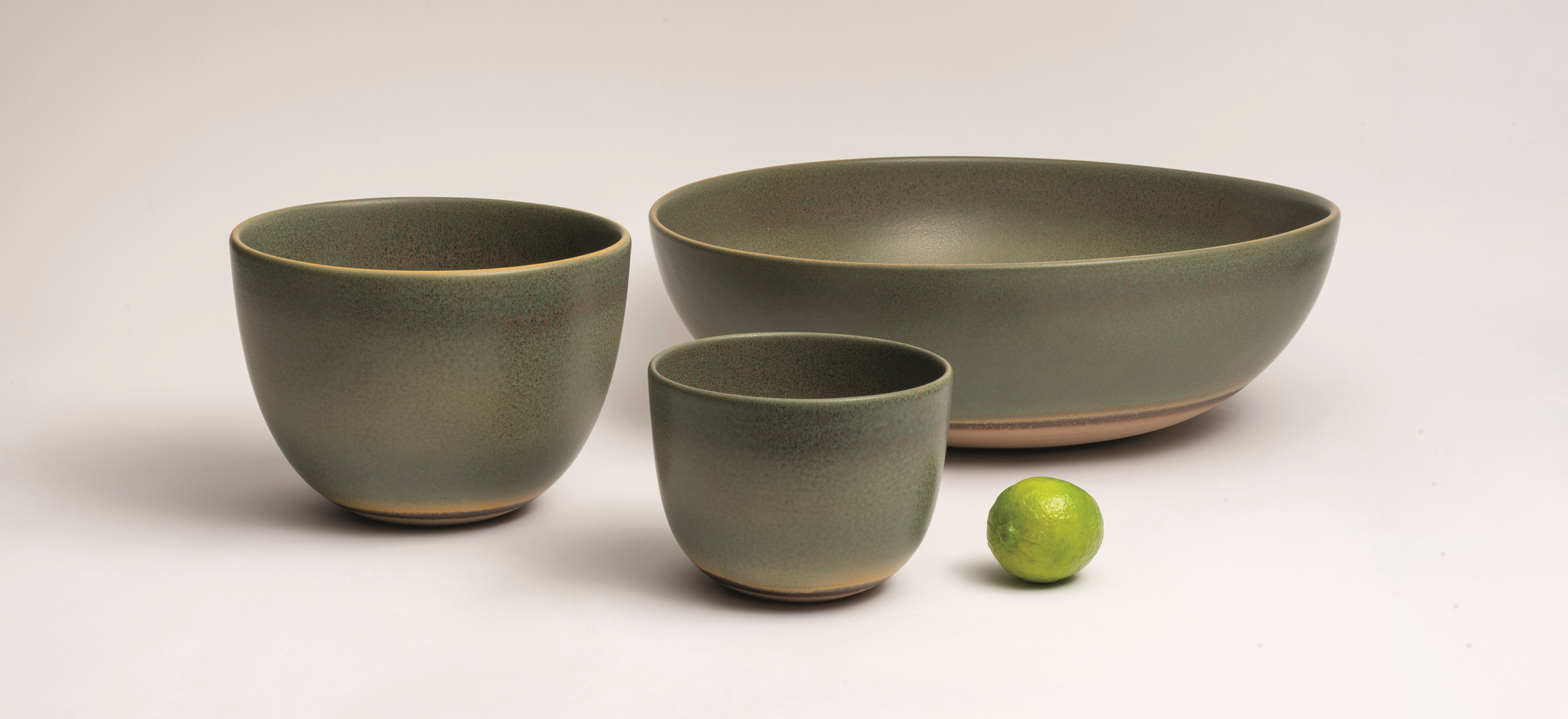 Protos bowls on a grey background.