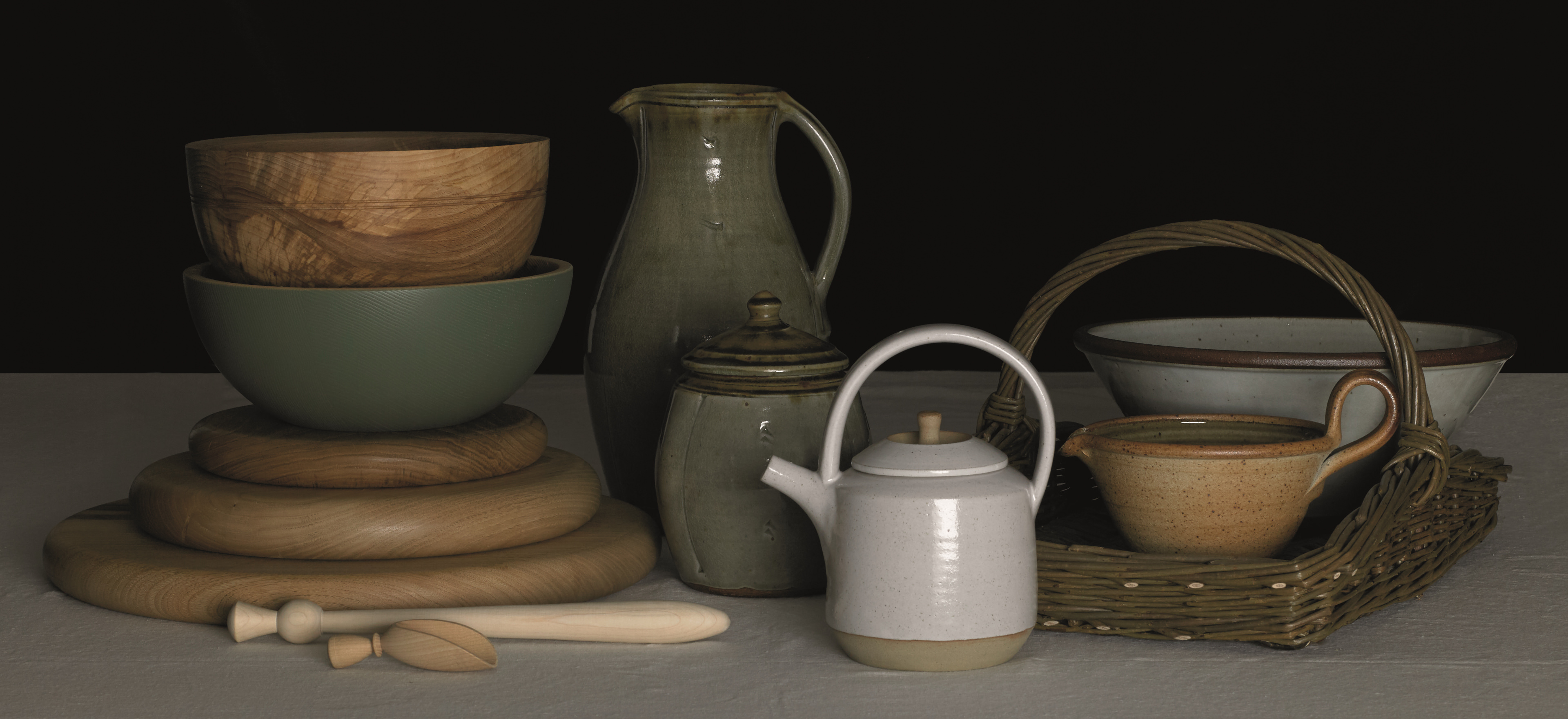 Craft  items from our pottery, woodware, horn and basketware ranges arranged on a black background.