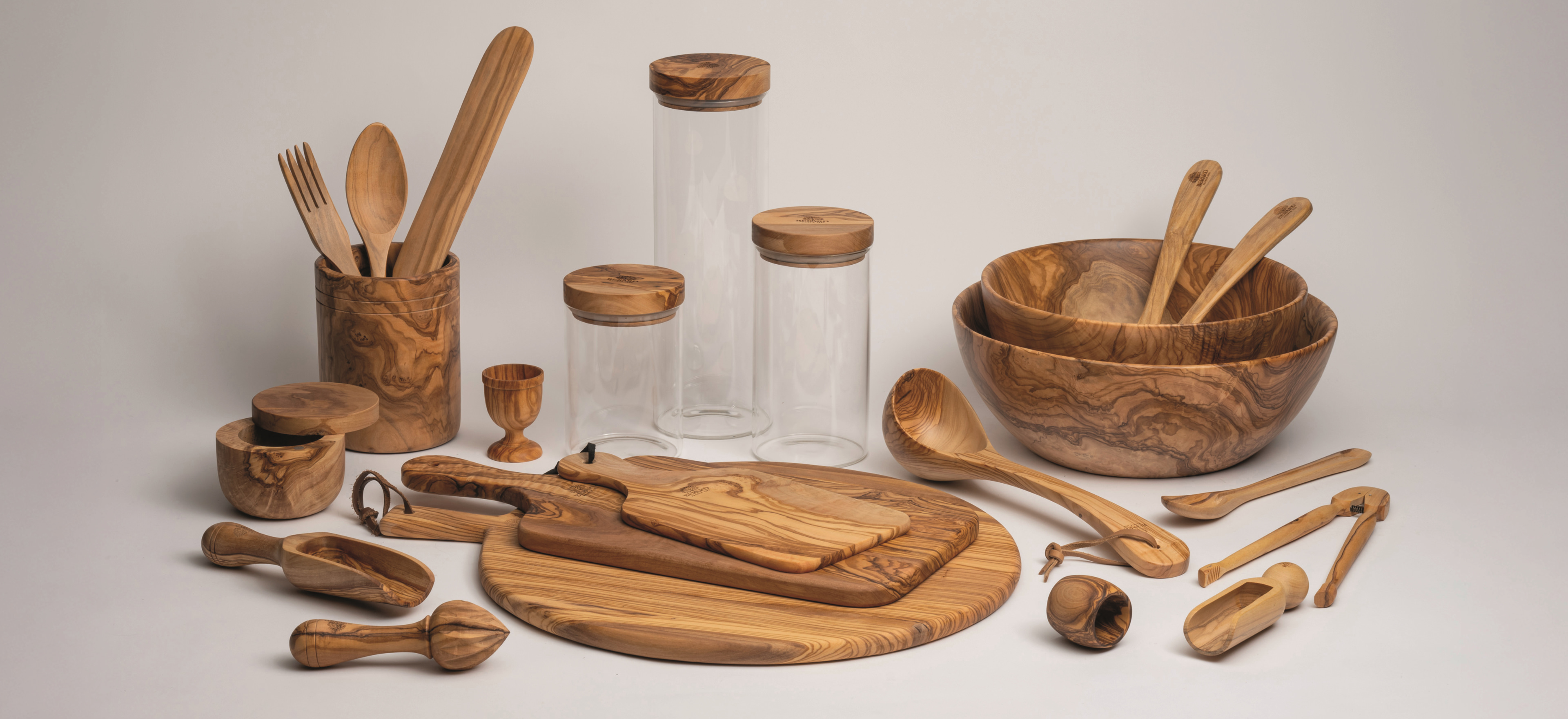 Bérard Frères woodware on a grey background.