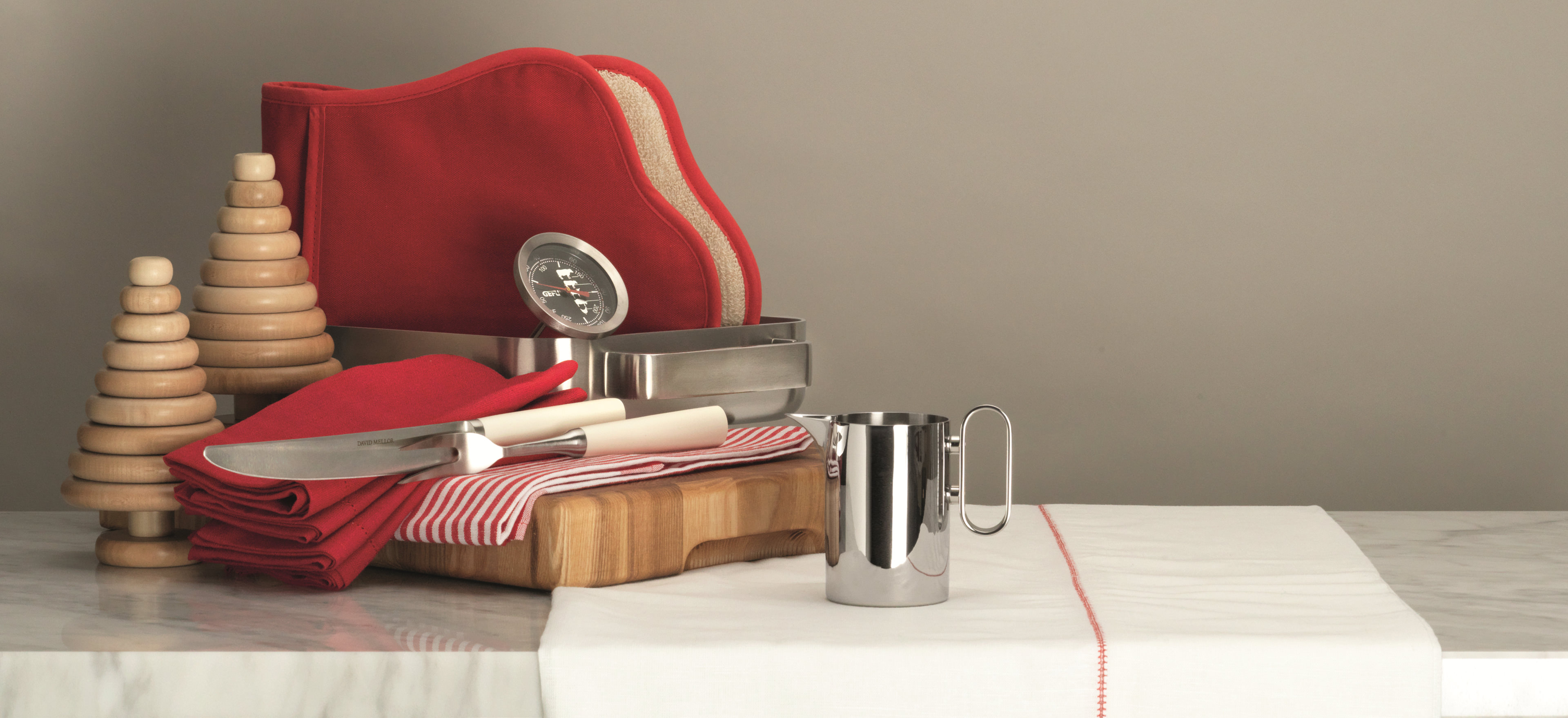 David Mellor cooking items arranged in a festive scene.