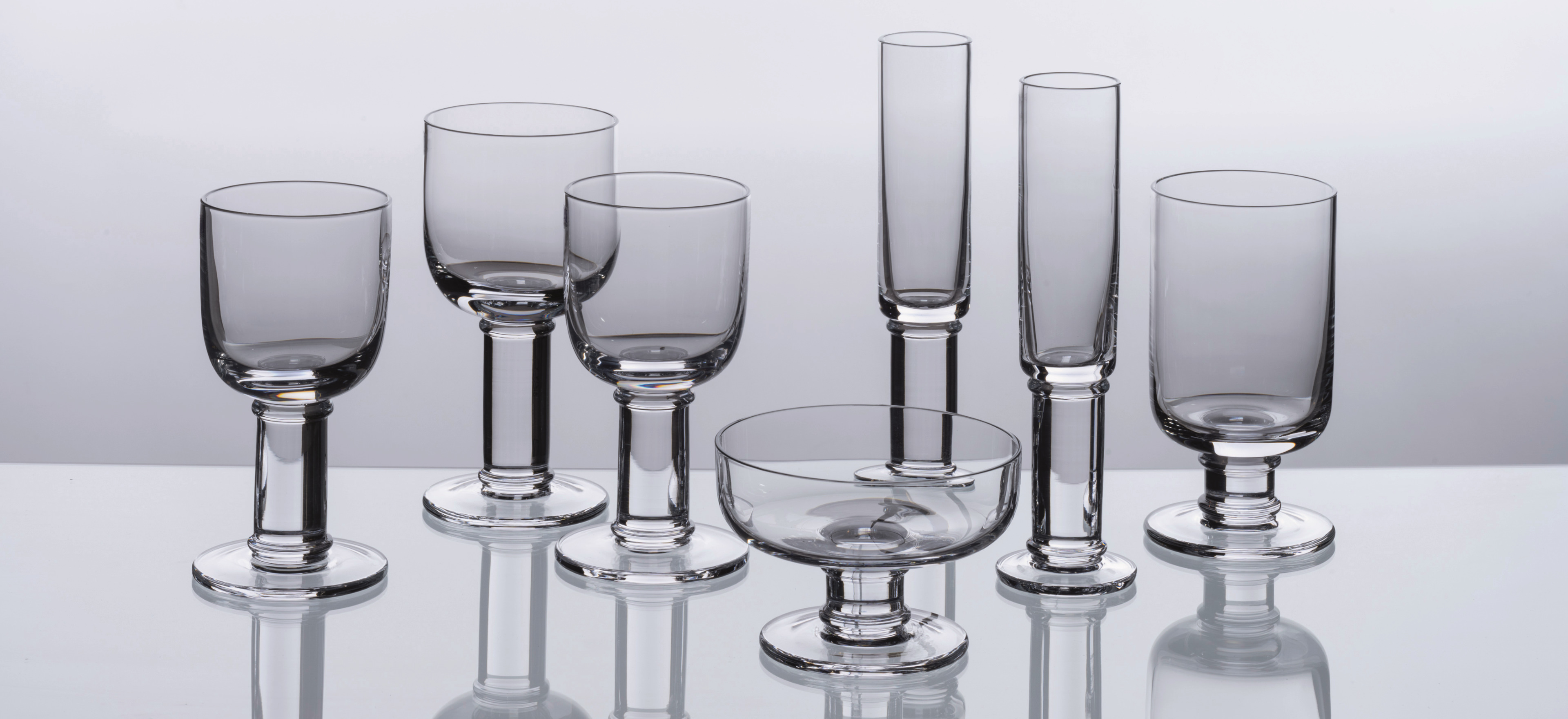 David Mellor Classic glassware on a grey background.