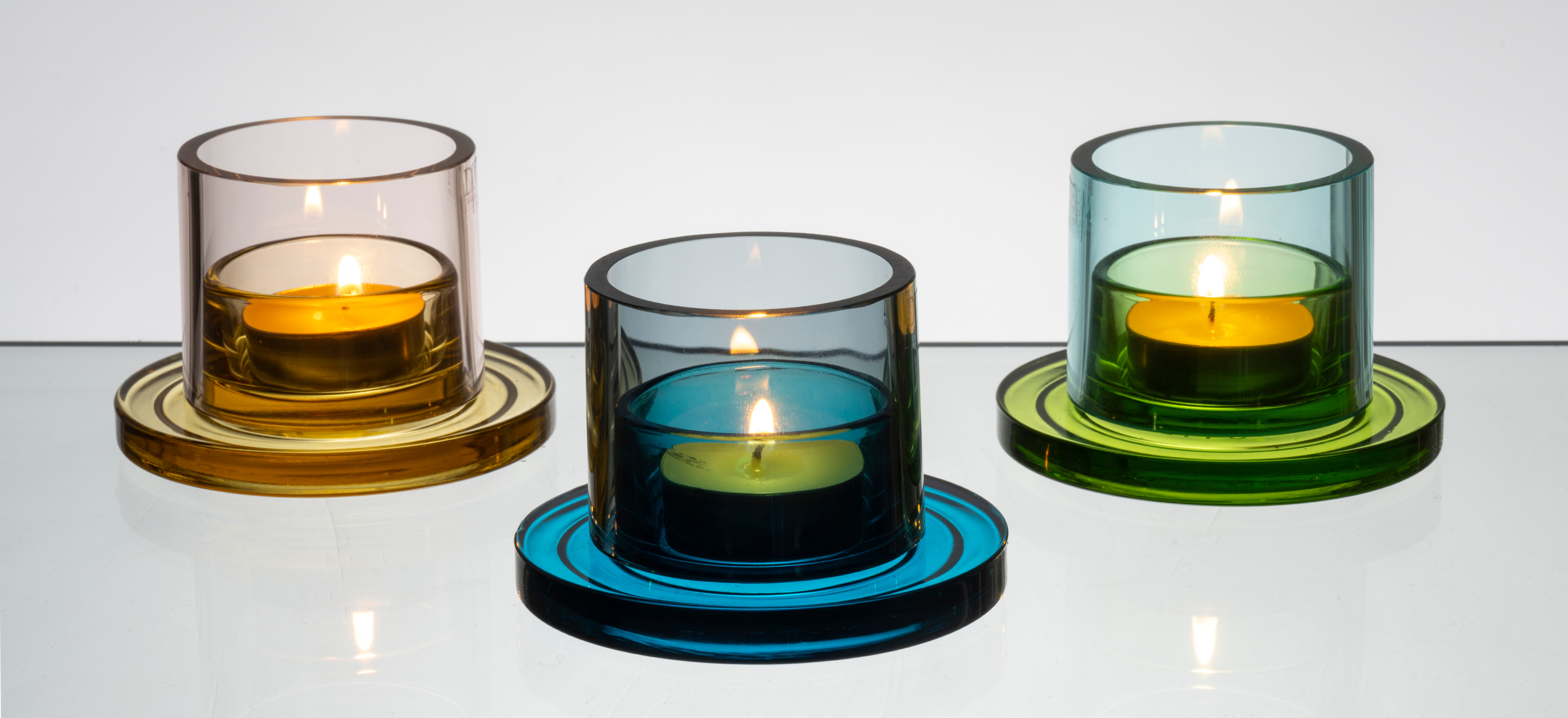 David Mellor collar candleholder on a grey background.