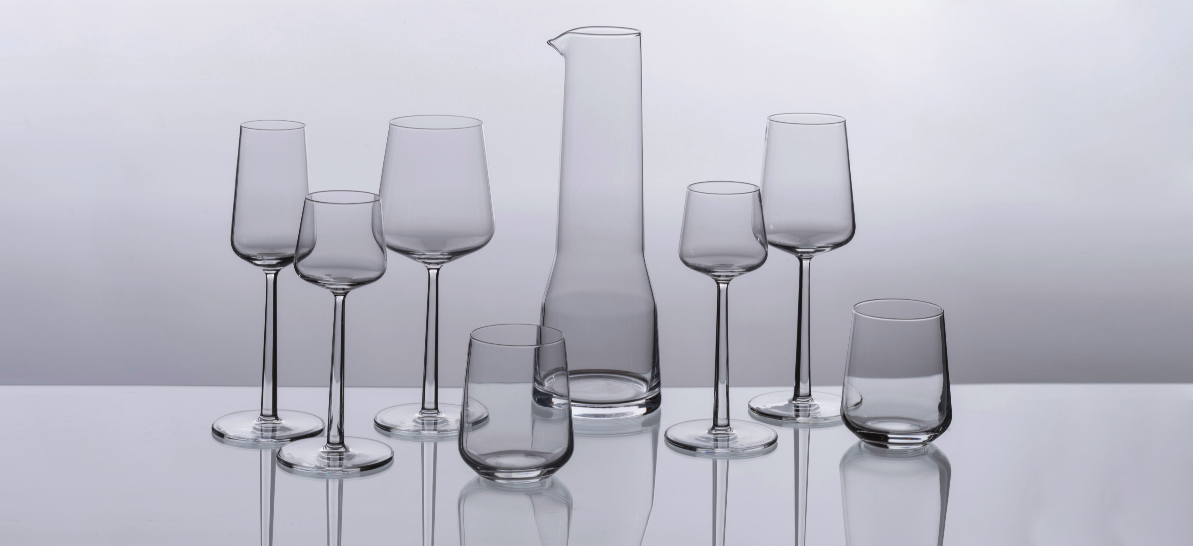 Iittala Essence glassware on a grey background.