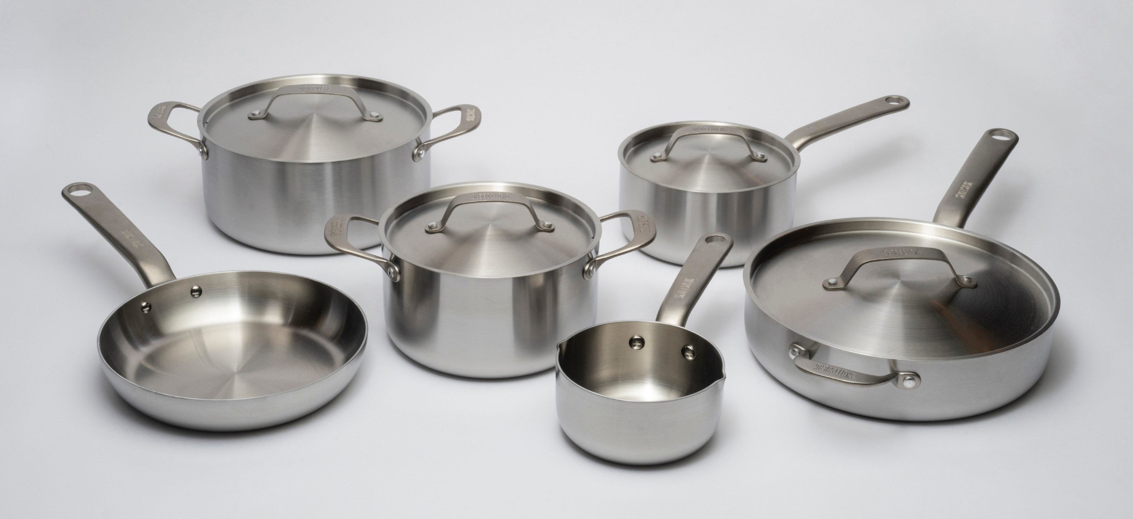Skottsberg stainless steel cookware on a grey background.