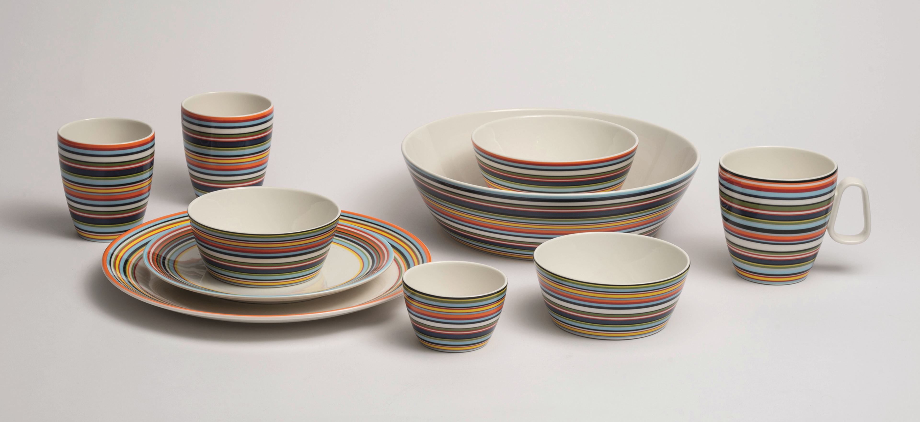 Iittala Origo fine bone china on a grey background.