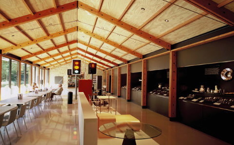 View of the Design Museum interior exhibits as seen from the direction of the shop. Traffic light system, internal caf&eacute; seating and display cabinets down the far wall.