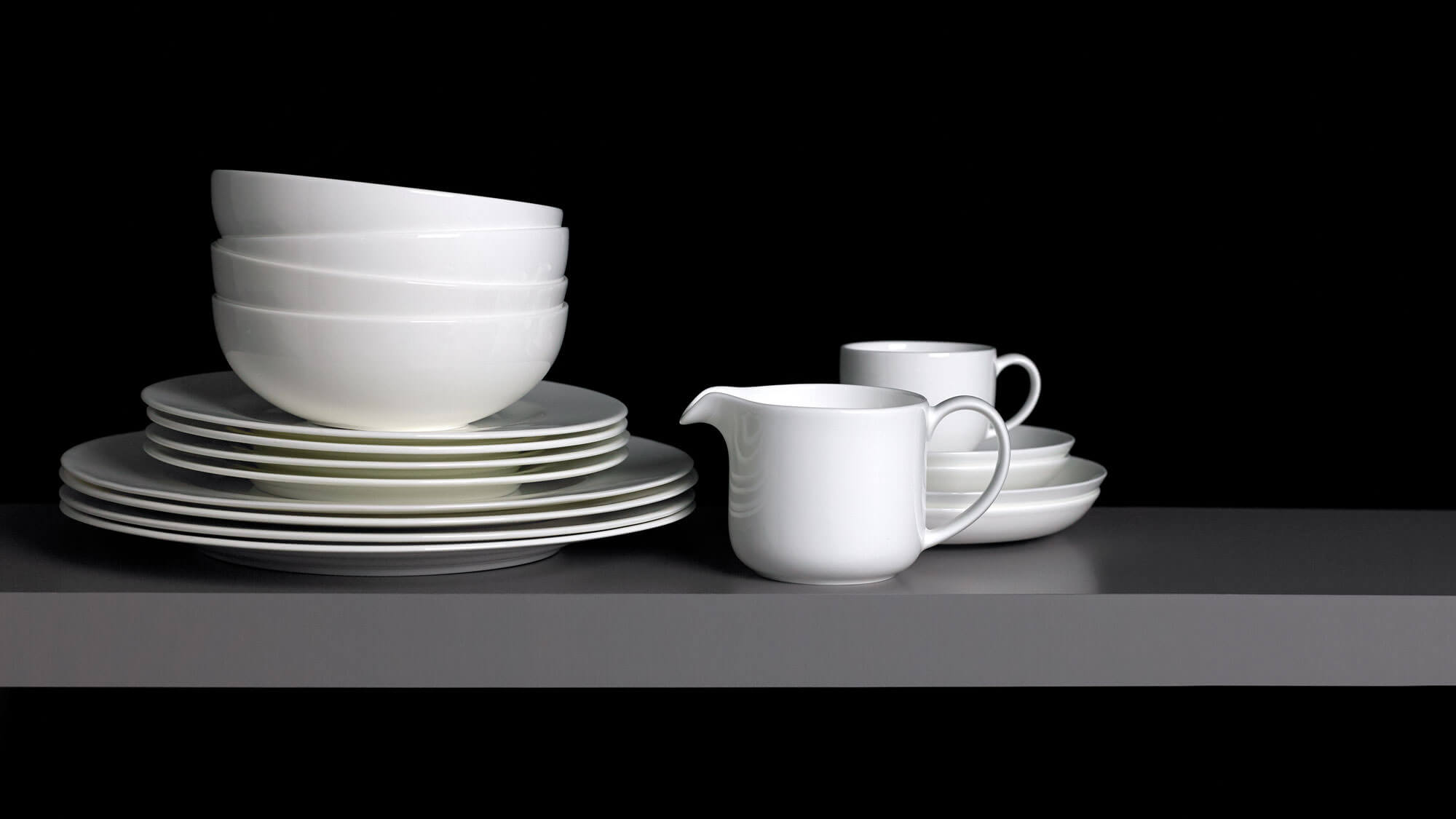 Tea cup, mug and small bowl from the fine bone china range displayed on a white background.