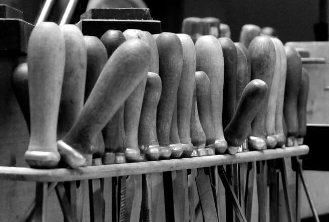 Tools hanging on the work bench.