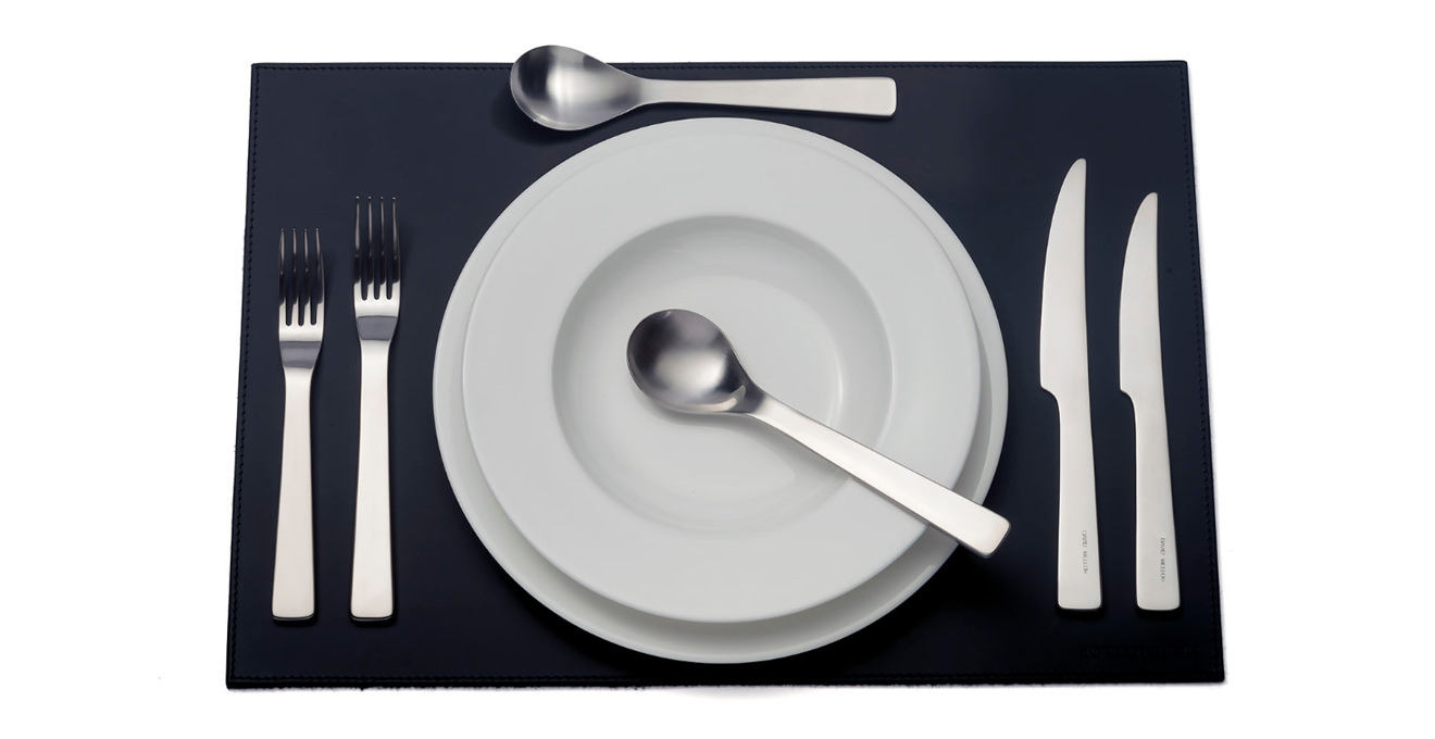 London cutlery laid out on a table mat.