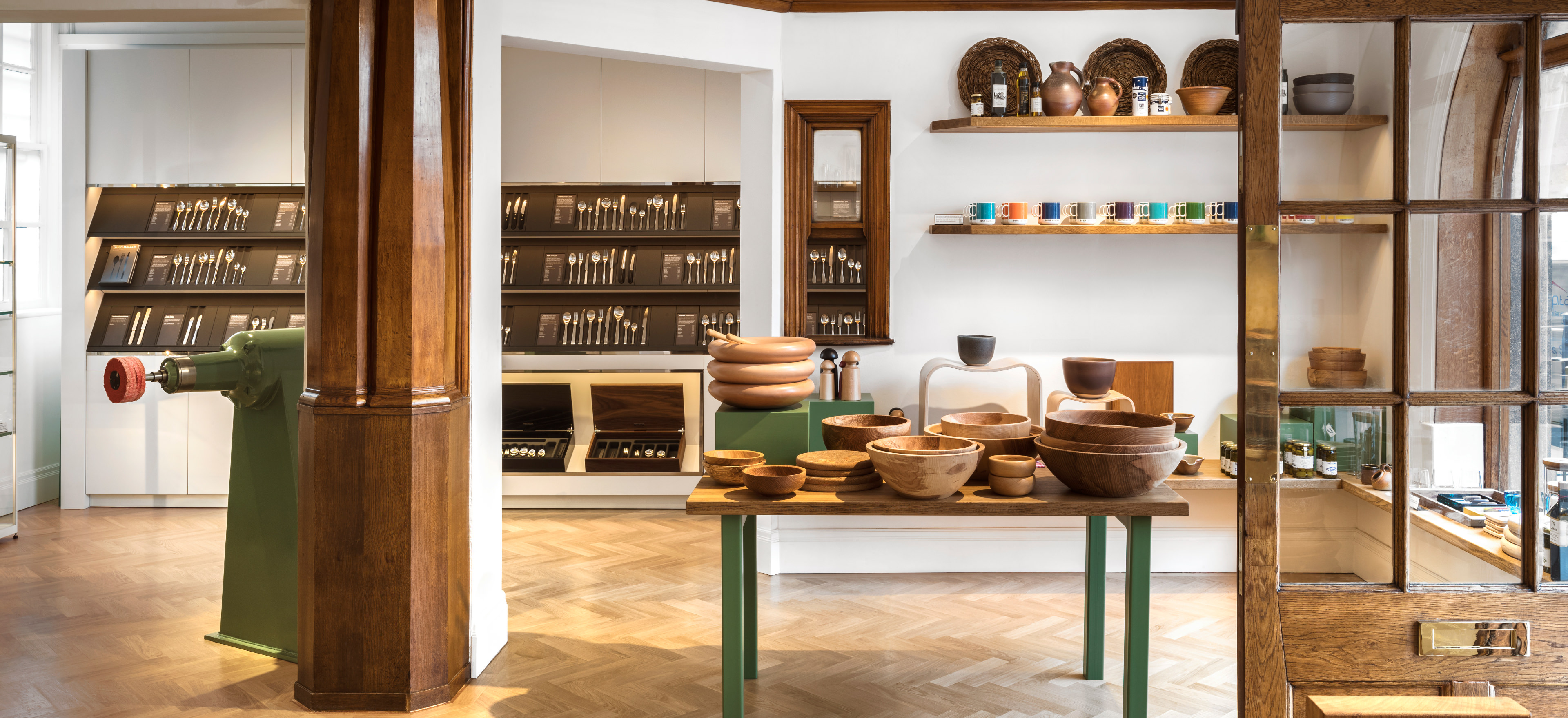 Wide shot of the shop interior including the cutlery and craft woodware displays.